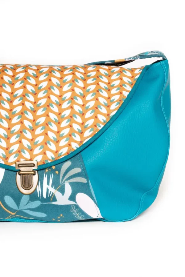 Sac besace Moka zoom sur attache cartable rétro et tissu imprimé lapins