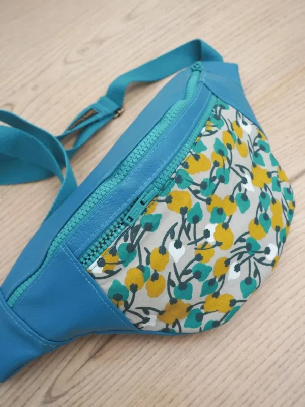 Banane originale Mia poche zippée simili cuir et tissu imprimé turquoise