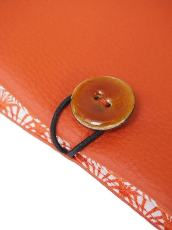 Portefeuille rouille éventails zoom sur le bouton coco