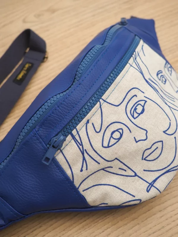 Banane l'originale Picassa vue fermeture zip poche devant imprimée visages