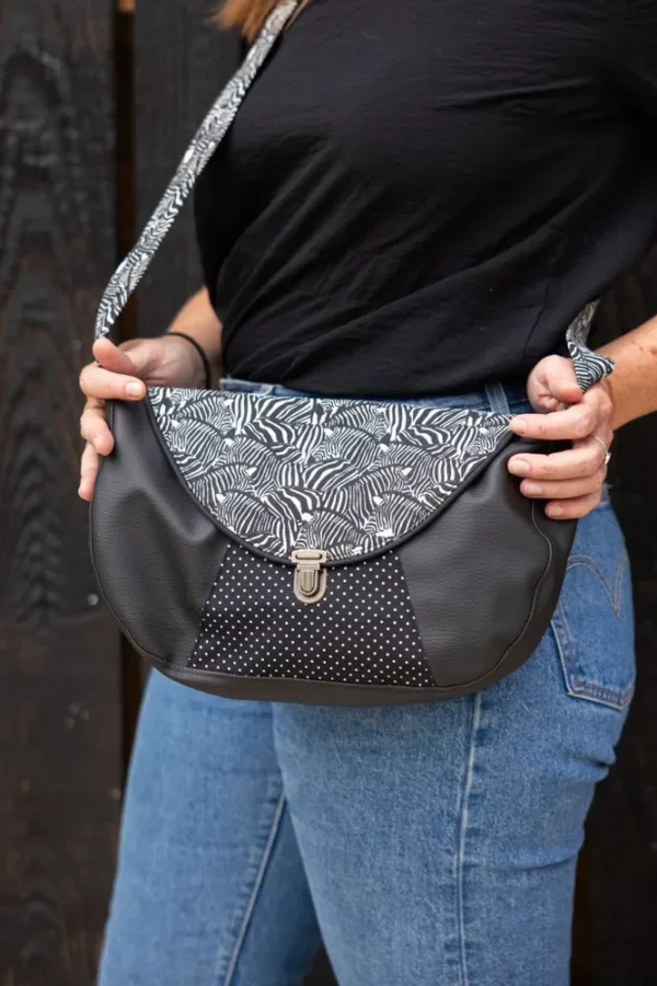 Sac besace femme porté simili cuir noir Zèbre pois